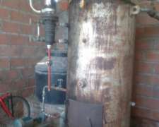 Caldera a Leña (marca Pelton) y Caldera a Gas.