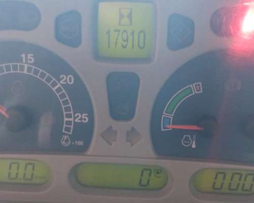 New Holland T7060, con Piloto